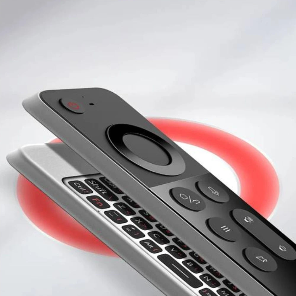Close-up of a remote control with a red circular object underneath on a light gray background