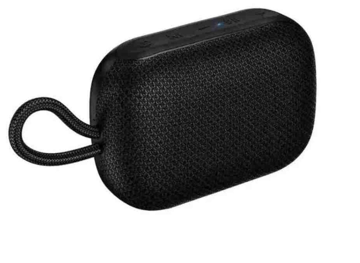 Black portable speaker with a rope handle on a white background