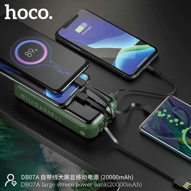 A green Hoco DB07A 20000mAh Power Bank from LebTech Store Lebanon simultaneously charging three smartphones using its integrated cables. The image demonstrates the power bank's high-capacity multi-device charging capability and its large digital LED screen displaying the remaining battery life.