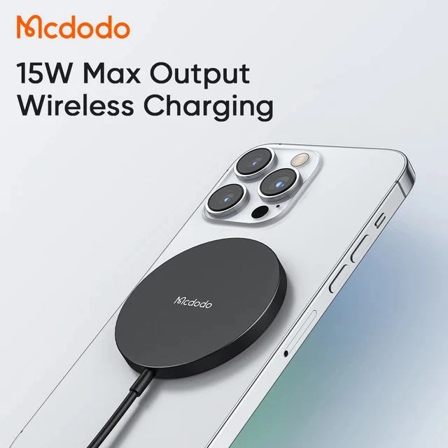 Mcdodo wireless charging pad on a smartphone with '15W Max Output' text.