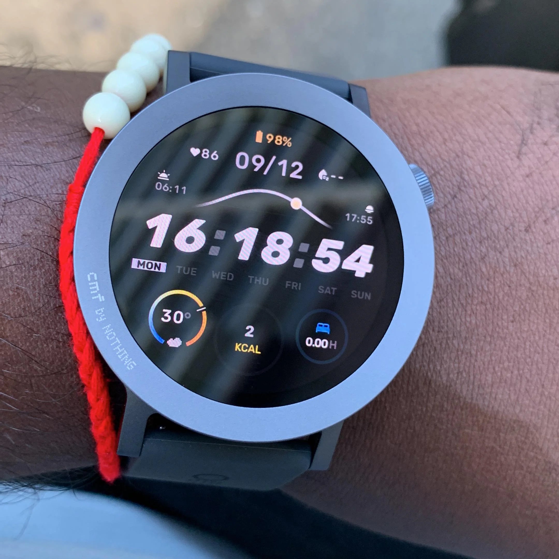 Real-life close-up of the CMF by Nothing Watch Pro 2 smartwatch worn on a wrist, showcasing its bright AMOLED display and custom digital watch face, from Lebtech Store Lebanon.