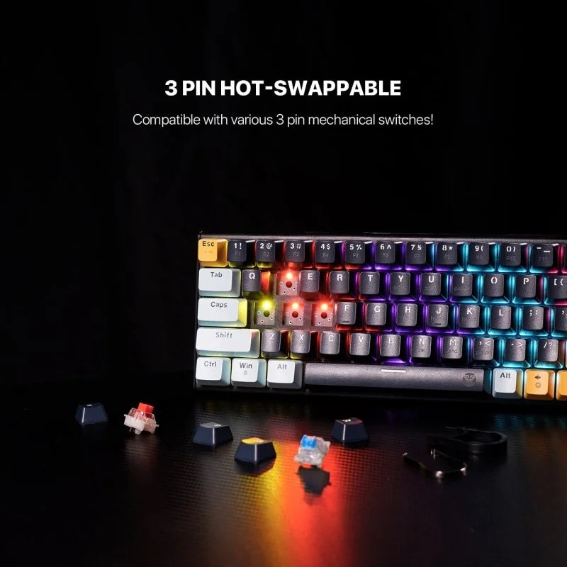 Mechanical keyboard with RGB lighting on a dark surface, featuring hot-swappable keycaps.