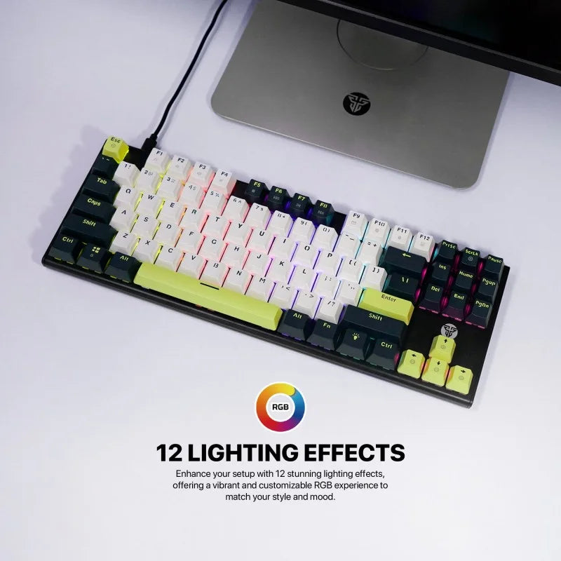 Mechanical keyboard with RGB lighting effects on a desk next to a computer monitor.