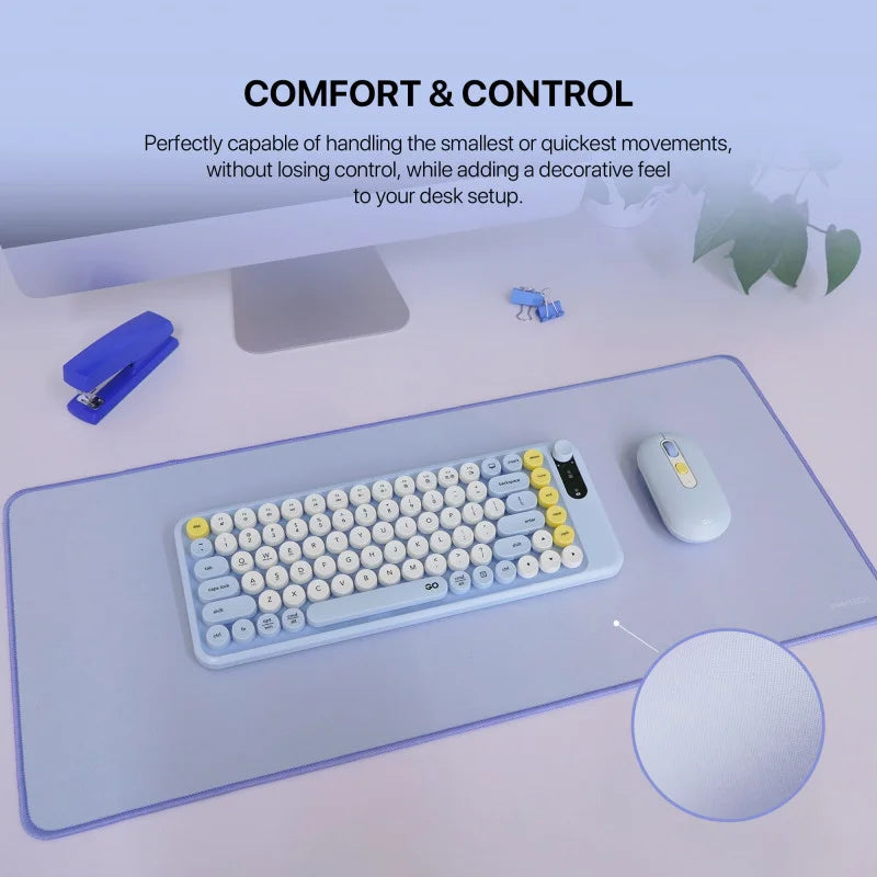 A lifestyle image of the light blue Fantech MP70 Large Desk Mat from LebTech Store Lebanon, shown on a desk with a matching mechanical keyboard and mouse. The image highlights "Comfort & Control" for precise movements and includes a close-up circle showing the smooth, high-quality fabric texture.