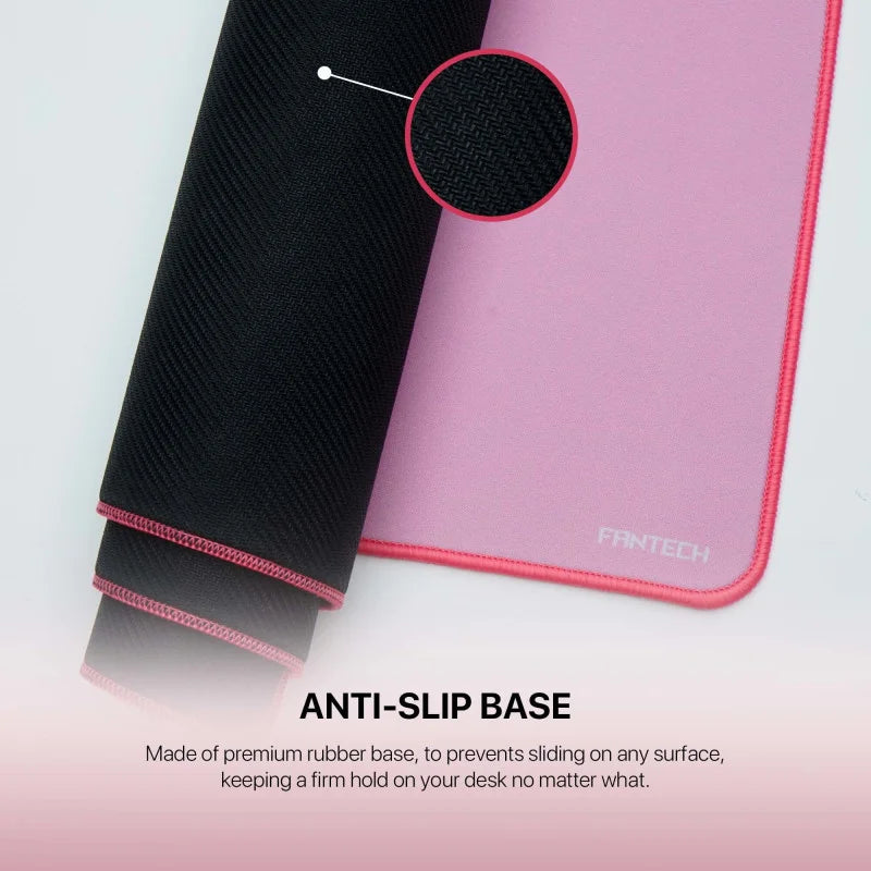 A close-up of the Fantech MP70 Large Desk Mat from LebTech Store Lebanon, showcasing its premium anti-slip rubber base. The image shows the pink top surface and the textured black bottom designed to provide a firm, non-slip grip on any desk surface.