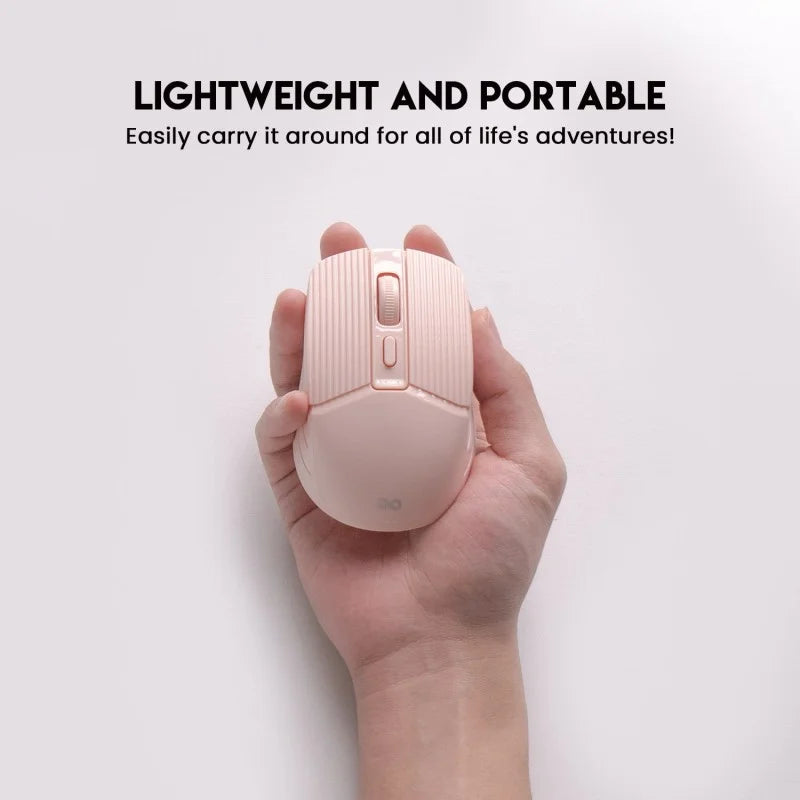 A person holding the pink Fantech GO W605 Wireless Mouse to demonstrate its lightweight and portable design. Available at LebTech Store Lebanon, this compact mouse is built for easy carrying, making it an ideal choice for work-on-the-go and travel.