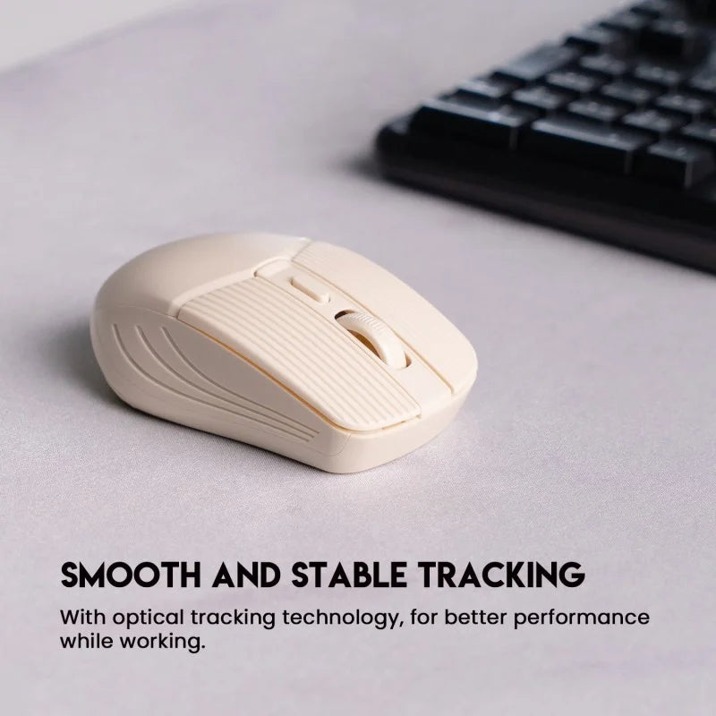 A beige Fantech GO W605 Wireless Mouse from LebTech Store Lebanon, shown on a desk next to a keyboard. The image highlights its optical tracking technology, which ensures smooth and stable performance for a better working experience.
