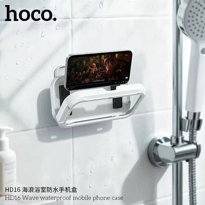 HOCO HD16 Wave waterproof bathroom mobile phone case mounted horizontally on white shower wall tiles next to a shower head, sold by Lebtech Store in Lebanon.