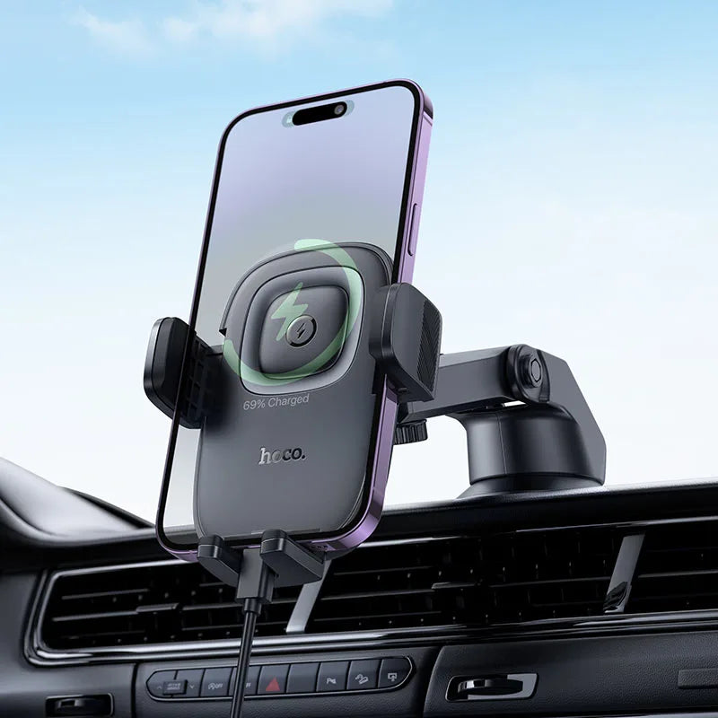 Phone holder with smartphone on a car dashboard, charging indicator visible