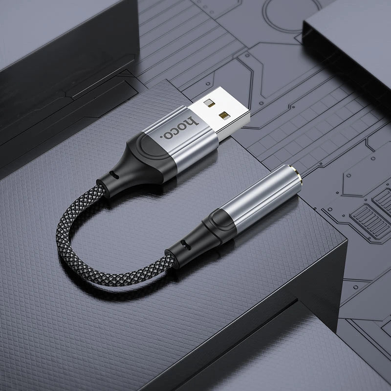 USB cable with braided design on a technical diagram background - Lebtech Store