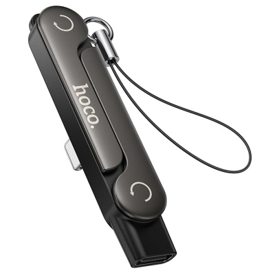 Hoco UA47 2-in-1 Lightning to Type-C adapter shown completely closed and folded flat with its attached black anti-loss lanyard string, from Lebtech Store Lebanon.
