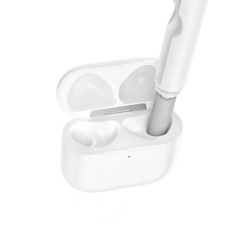 Hoco UT1 3-in-1 Digital Cleaning Pen using its soft flocking sponge tip to clean inside a wireless earbud charging case at Lebtech Store Lebanon.
