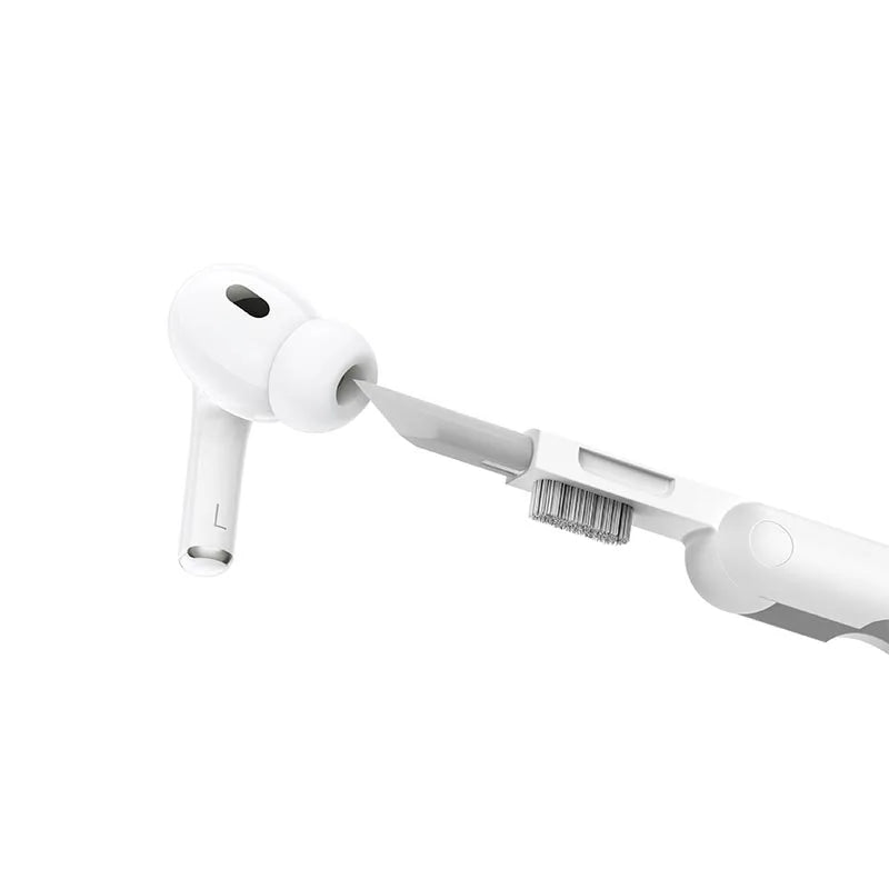 Hoco UT1 3-in-1 Digital Cleaning Pen utilizing its precision scraper tip to clean an Apple AirPod earbud mesh at Lebtech Store Lebanon.
