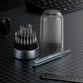 Hoco UT11 FixMaster 31-in-1 Precision Screwdriver Set displaying the aluminum handle handle, magnetic multi-bit carousel, and ribbed transparent cover capsule on a grid desk setup at Lebtech Store Lebanon.
