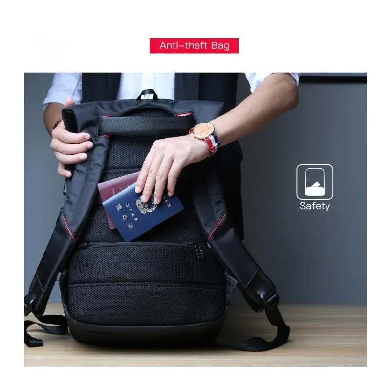 Person holding an anti-theft bag with visible security features on a plain background