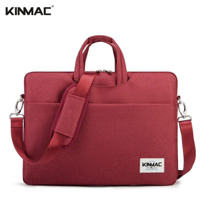 Red laptop bag with shoulder strap on a white background, featuring the KINMAC brand.