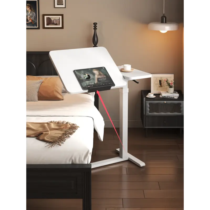 Multi-function height-adjustable white desk used as a bedside table from LebTech Store Lebanon, showing a tilted surface for a tablet and an ergonomic sit-stand design with fast delivery across Lebanon.
