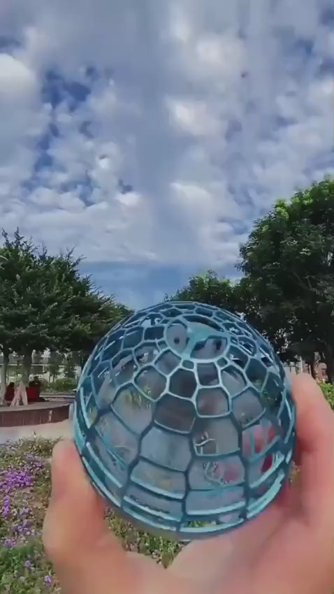 A video showing a human hand throwing a motorized flying spinner orb ball into the air, demonstrating how it floats and comes back automatically like a boomerang, available at LebTech Store in Lebanon.