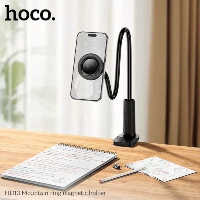 Black magnetic holder with smartphone on a wooden desk with a notebook and drawing - Lebtech store