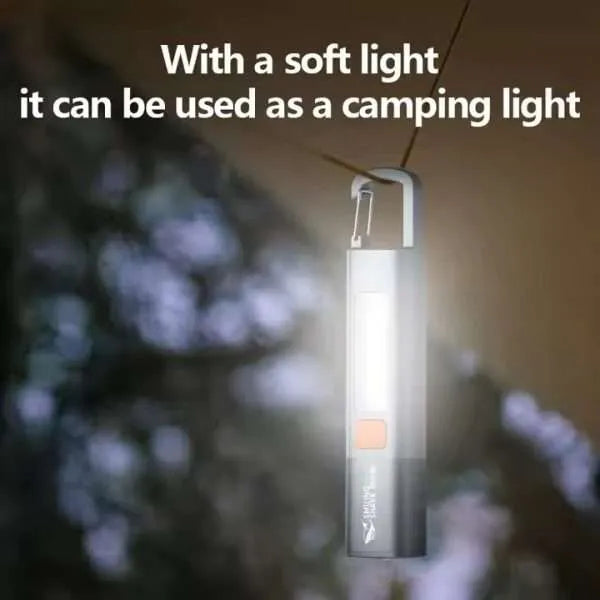 Smiling Shark pocket torch hanging from a tent cord using its lock buckle clip to act as a soft camping lantern light from LebTech Store Lebanon.