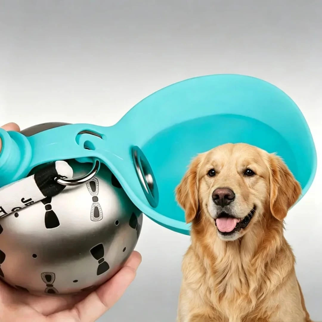 A hand holding a spherical stainless steel travel dog water bottle featuring a turquoise blue leaf silicone drinking bowl next to a happy Golden Retriever, from LebTech Store Lebanon.