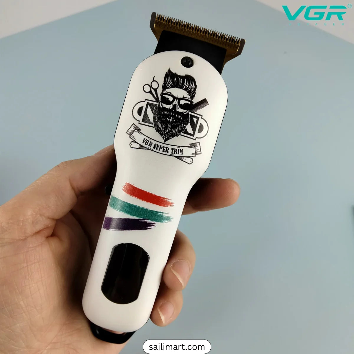 VGR V971 Hair clipper with a design on the handle held by a hand, against a light blue background - LebTech Store Lebanon